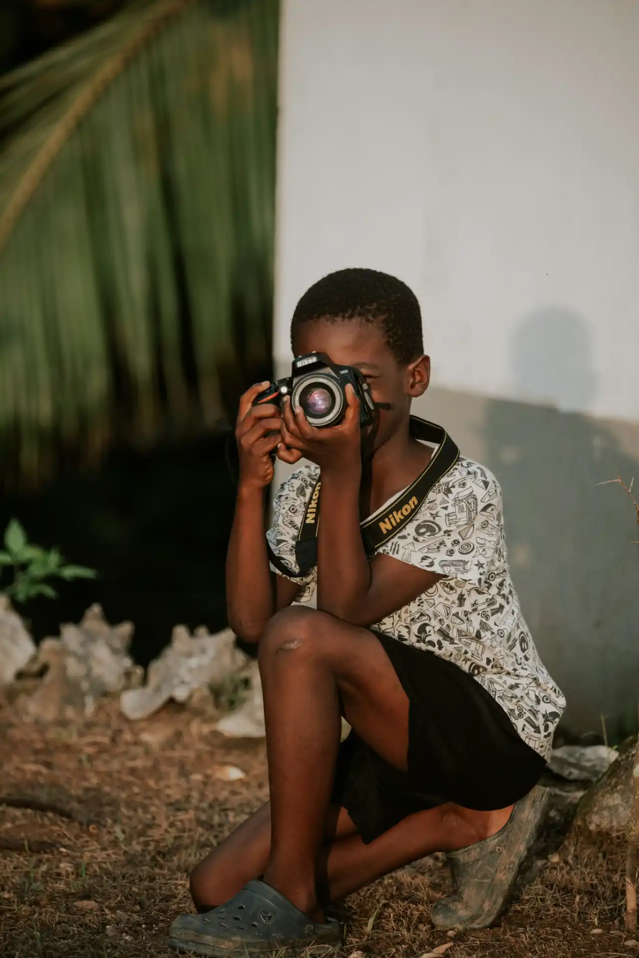 Child holding a camera
