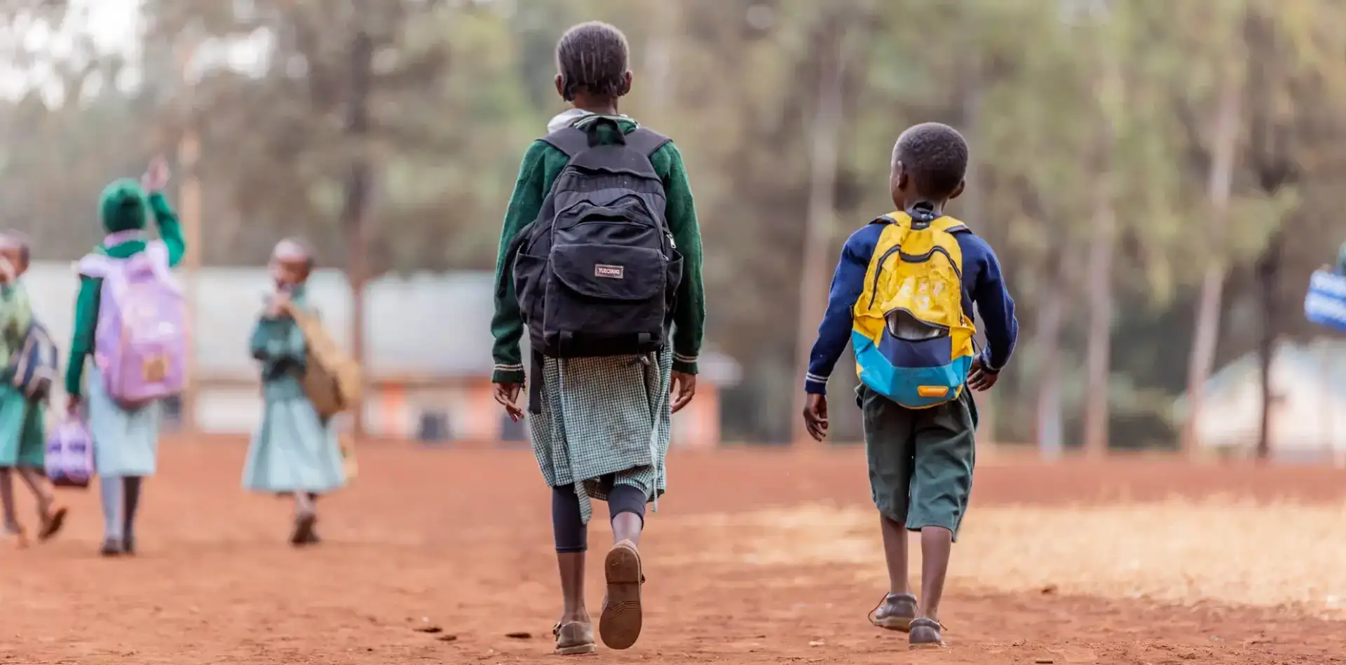 Children playing at a colorful bouncy castle